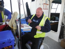 Pete Bailey sitting comfortable preparing his bait